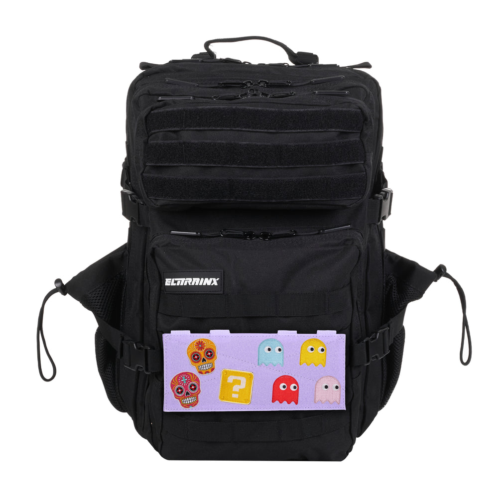 Black backpack with a lavender Velcro panel and various decorative patches.